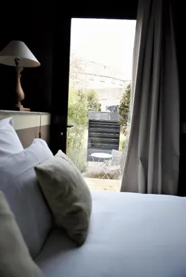 Un ou plusieurs lits dans un hébergement de l'établissement Hôtel Particulier - La Chamoiserie