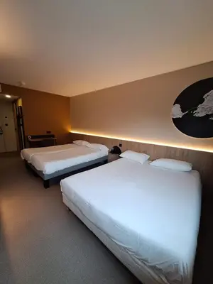 Un ou plusieurs lits dans un hébergement de l'établissement B&B HOTEL La Rochelle Centre Les Minimes