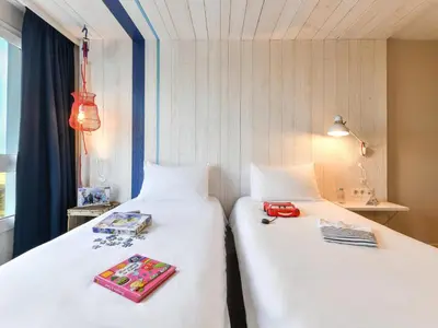 Un ou plusieurs lits dans un hébergement de l'établissement ibis styles La Rochelle Thalasso Chatelaillon