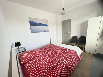 Un ou plusieurs lits dans un hébergement de l'établissement Appartement La Guignette