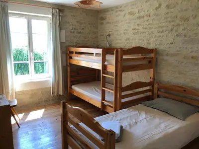 Un ou plusieurs lits dans un hébergement de l'établissement Gites de Cognac