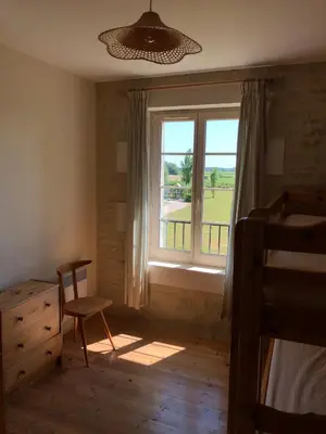 Un ou plusieurs lits dans un hébergement de l'établissement Gites de Cognac