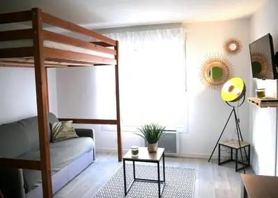 Un ou plusieurs lits dans un hébergement de l'établissement Futurostudio - Appart Hôtel Futuroscope - Poitiers