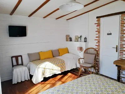 Un ou plusieurs lits dans un hébergement de l'établissement Les Chambres De La Loge