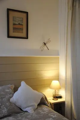 Un ou plusieurs lits dans un hébergement de l'établissement Les Chambres De La Loge