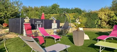 Jardin de l'établissement Chambre d'Hôtes Les Orchidées FUTUROSCOPE CHASSENEUIL POITIERS