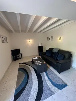 Coin salon dans l'établissement Petit Moulin De Veillard
