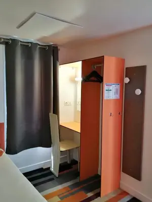 Un ou plusieurs lits dans un hébergement de l'établissement Kyriad Direct Saintes
