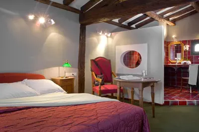 Un ou plusieurs lits dans un hébergement de l'établissement Relais du Bois Saint Georges - Hôtel de Charme
