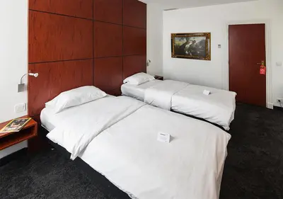 Un ou plusieurs lits dans un hébergement de l'établissement Hotel de Bordeaux