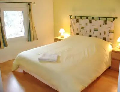 Un ou plusieurs lits dans un hébergement de l'établissement Maison de charme avec piscine et jardin à Saint-Vincent-la-Châtre