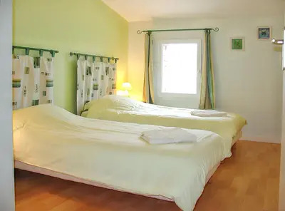 Un ou plusieurs lits dans un hébergement de l'établissement Maison de charme avec piscine et jardin à Saint-Vincent-la-Châtre