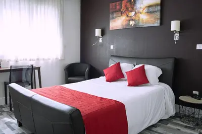 Un ou plusieurs lits dans un hébergement de l'établissement Cit'Hotel Europeen