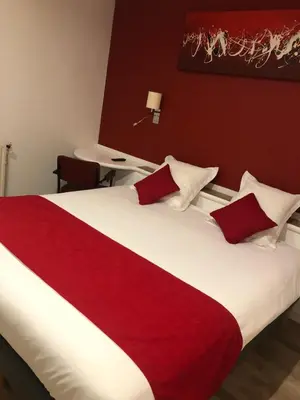 Un ou plusieurs lits dans un hébergement de l'établissement Cit'Hotel Europeen