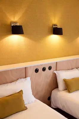 Un ou plusieurs lits dans un hébergement de l'établissement Hôtel Henri IV