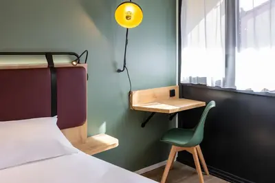 Un ou plusieurs lits dans un hébergement de l'établissement Campanile NATURE - La Rochelle Puilboreau