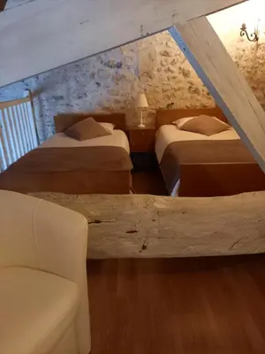 Un ou plusieurs lits dans un hébergement de l'établissement La charentaise ch d'hôtes ,Studio