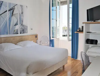 Un ou plusieurs lits dans un hébergement de l'établissement Hotel La Marine, Vieux Port