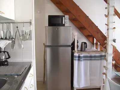 Cuisine ou kitchenette dans l'établissement Appartements Les remparts d'Alienor