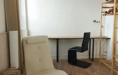 Coin salon dans l'établissement Appartements Les remparts d'Alienor