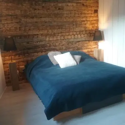 Un ou plusieurs lits dans un hébergement de l'établissement B&B Le verger