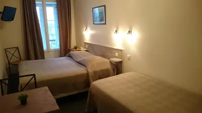 Un ou plusieurs lits dans un hébergement de l'établissement Hôtel de l'Océan
