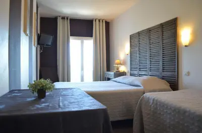 Un ou plusieurs lits dans un hébergement de l'établissement Hôtel de l'Océan