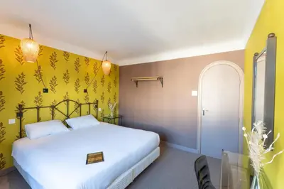 Un ou plusieurs lits dans un hébergement de l'établissement Grand Hôtel Niort Centre