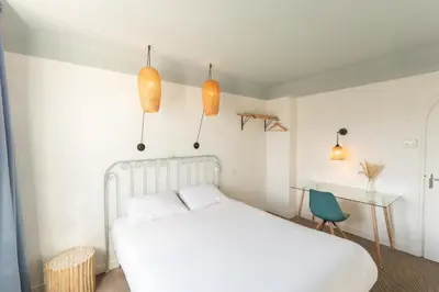 Un ou plusieurs lits dans un hébergement de l'établissement Grand Hôtel Niort Centre