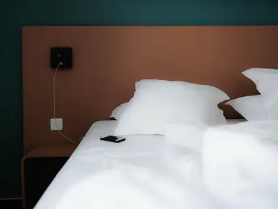 Un ou plusieurs lits dans un hébergement de l'établissement Logis Hôtel de l'Europe