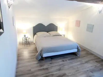 Un ou plusieurs lits dans un hébergement de l'établissement Maison spacieuse à Cabariot