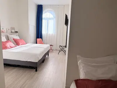 Un ou plusieurs lits dans un hébergement de l'établissement Hôtel La Fabrique