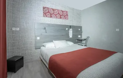 Un ou plusieurs lits dans un hébergement de l'établissement Hôtel Mac Bed