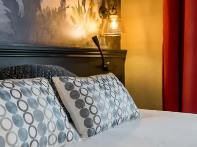 Un ou plusieurs lits dans un hébergement de l'établissement Hôtel Mercure Rochefort La Corderie Royale