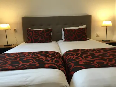 Un ou plusieurs lits dans un hébergement de l'établissement Hôtel du Moulin