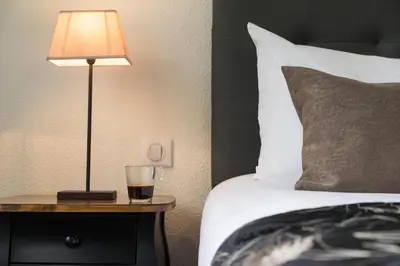 Un ou plusieurs lits dans un hébergement de l'établissement Hôtel du Moulin