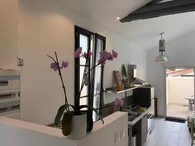 Cuisine ou kitchenette dans l'établissement Le Clos du Square - climatisé