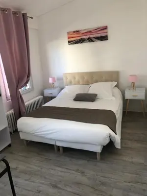 Un ou plusieurs lits dans un hébergement de l'établissement Central Hotel