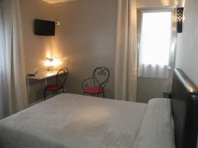 Un ou plusieurs lits dans un hébergement de l'établissement Hôtel de L'Avenue