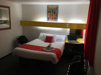 Un ou plusieurs lits dans un hébergement de l'établissement Quick Palace Poitiers