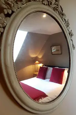 Un ou plusieurs lits dans un hébergement de l'établissement Chambres d'Hôtes Maison La Porte Rouge