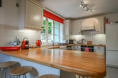 Cuisine ou kitchenette dans l'établissement La Maison Muguet