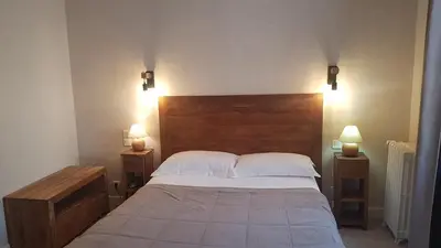 Un ou plusieurs lits dans un hébergement de l'établissement hôtel restaurant Beau-rivage