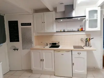 Cuisine ou kitchenette dans l'établissement Le Cottage