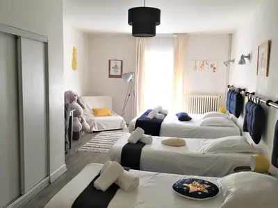 Un ou plusieurs lits dans un hébergement de l'établissement Hotel Au Marais