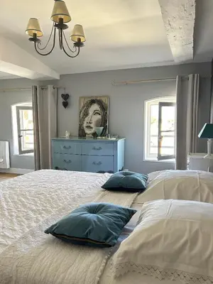 Un ou plusieurs lits dans un hébergement de l'établissement Le Jardin des Anges