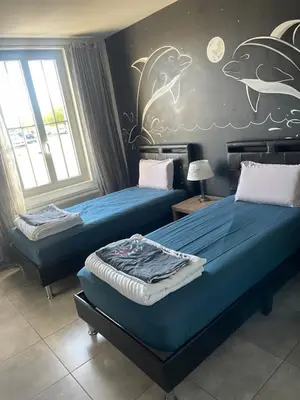 Un ou plusieurs lits dans un hébergement de l'établissement Villa Atlantique Rochefort