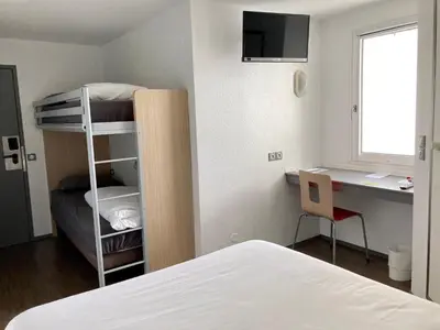 Un ou plusieurs lits dans un hébergement de l'établissement Première Classe La Rochelle Sud-Aytré