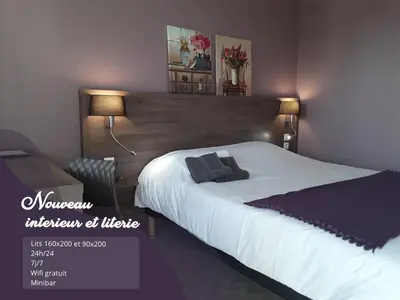 Un ou plusieurs lits dans un hébergement de l'établissement Relais La Fleur