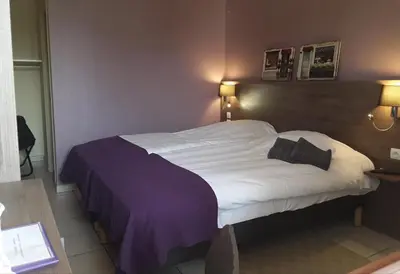 Un ou plusieurs lits dans un hébergement de l'établissement Relais La Fleur